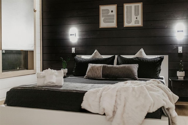 bedroom with wooden walls