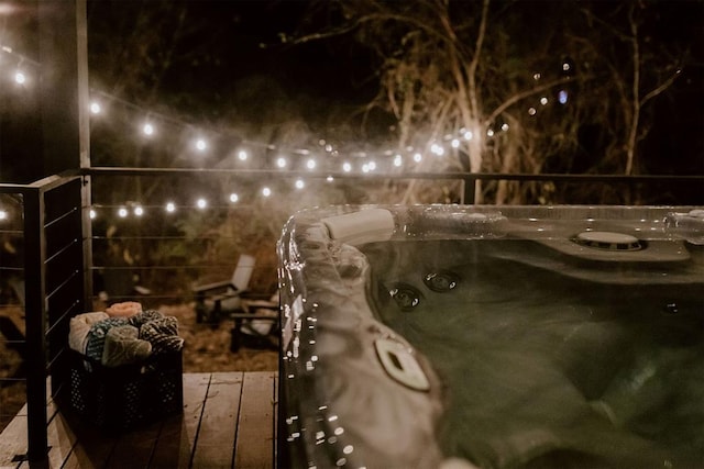 yard at twilight with an outdoor hot tub