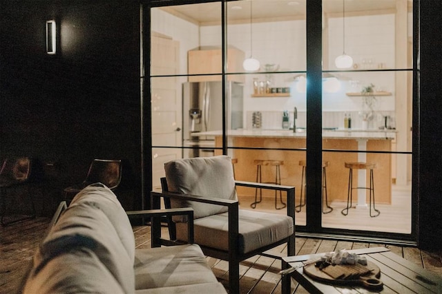 interior space with light hardwood / wood-style floors and sink