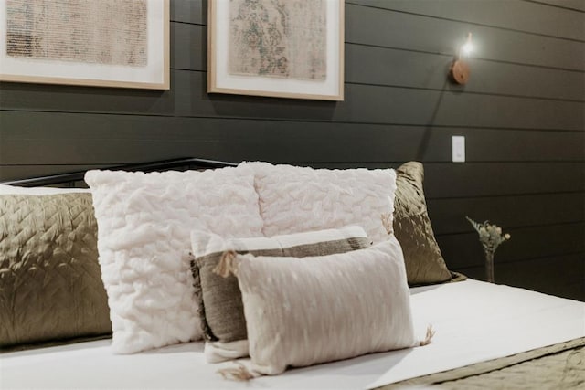 bedroom with wooden walls