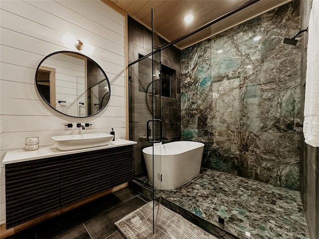 bathroom with tile patterned floors, shower with separate bathtub, vanity, wood ceiling, and tile walls