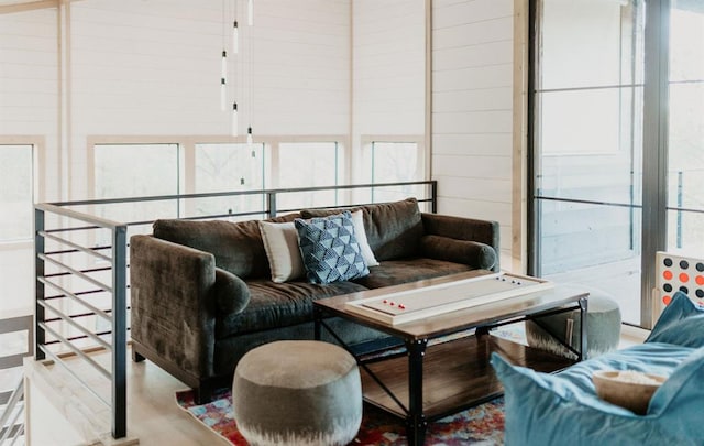 living room with wood walls