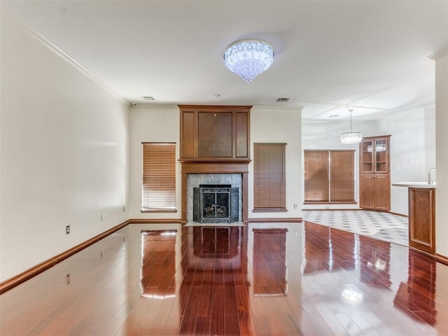 kitchen featuring a chandelier, hardwood / wood-style floors, and ornamental molding