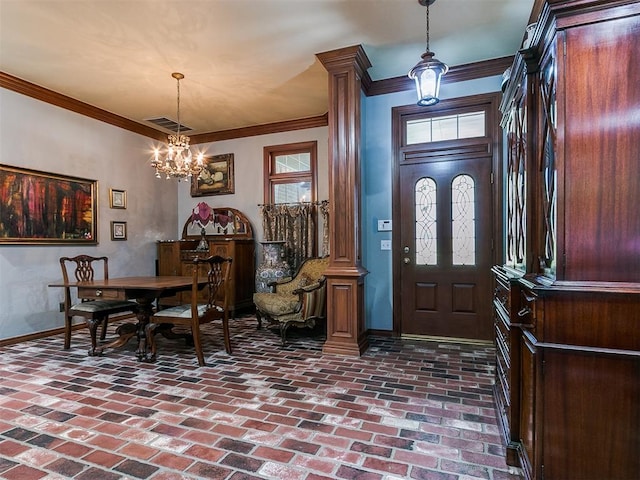 entryway with a chandelier and ornamental molding