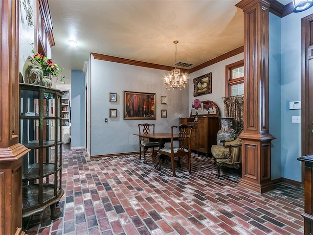 dining room featuring a chandelier, crown molding, and decorative columns