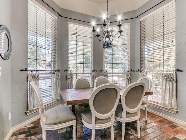 dining room featuring a notable chandelier