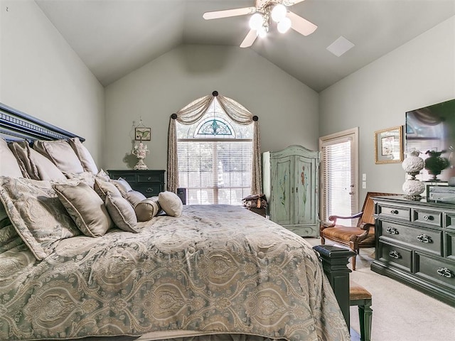 carpeted bedroom featuring ceiling fan, vaulted ceiling, and multiple windows