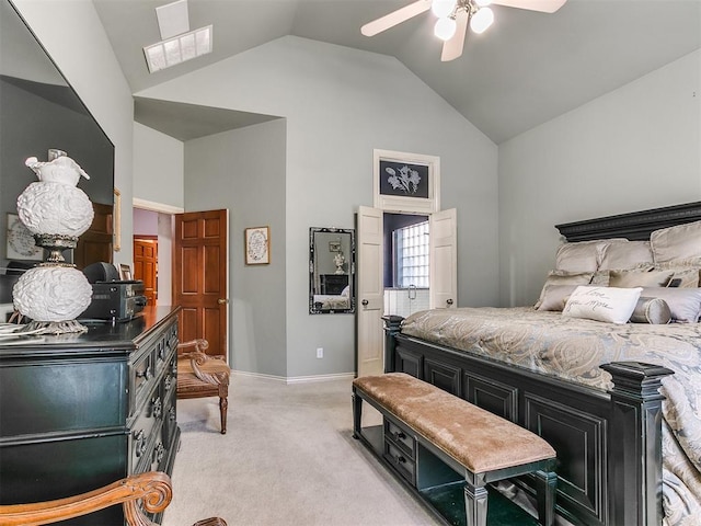 carpeted bedroom featuring ceiling fan and vaulted ceiling