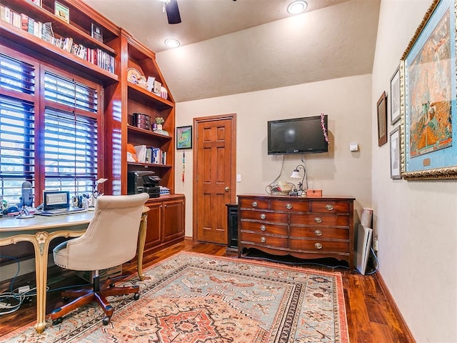 office with dark hardwood / wood-style floors, ceiling fan, and lofted ceiling