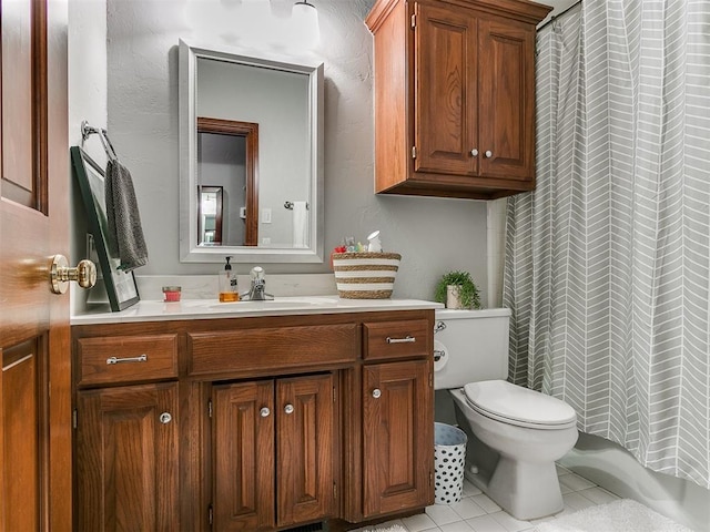 bathroom featuring tile patterned flooring, vanity, toilet, and a shower with curtain