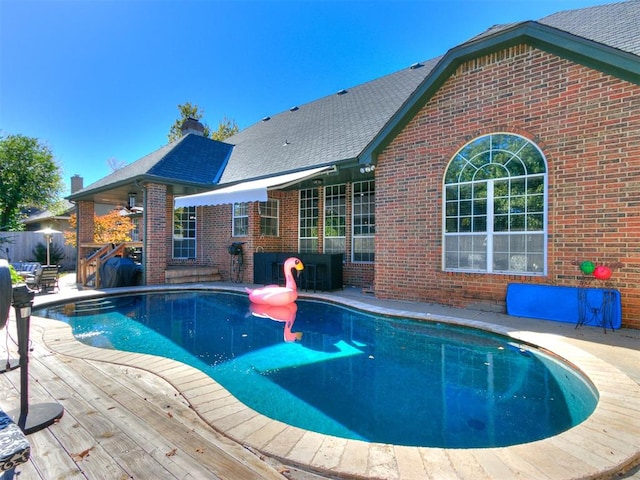 view of pool featuring a patio