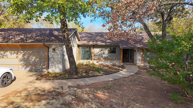 single story home featuring a garage