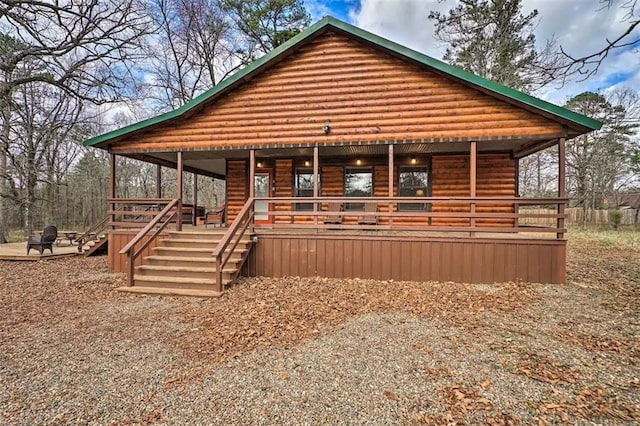 log cabin with covered porch