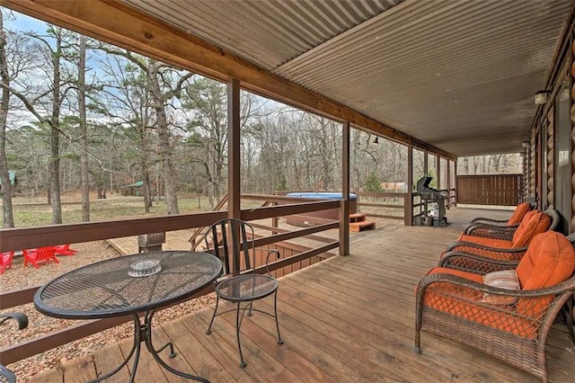 deck featuring a hot tub