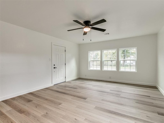 unfurnished room featuring ceiling fan and light wood-type flooring