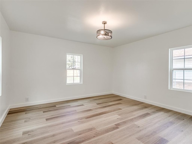 empty room with light hardwood / wood-style floors