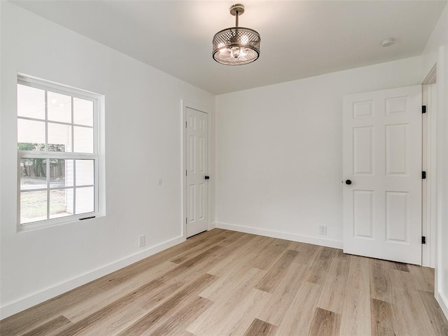 spare room featuring light wood-type flooring