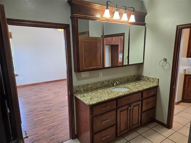 bathroom with vanity and hardwood / wood-style flooring