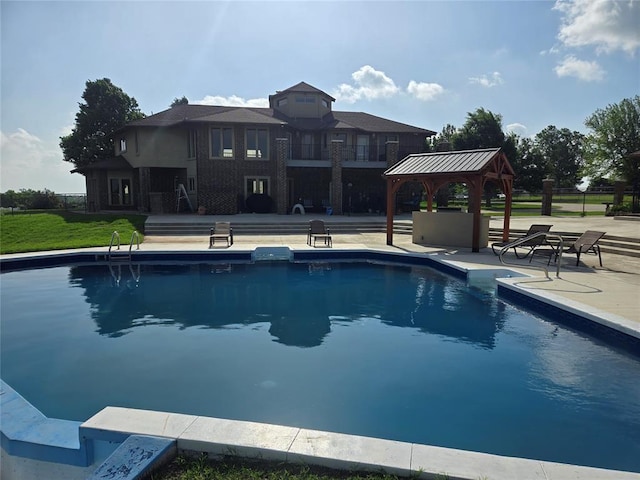 view of swimming pool with a gazebo and a patio