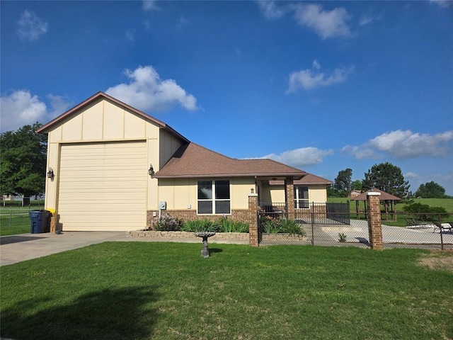 view of front of house with a front yard and a garage