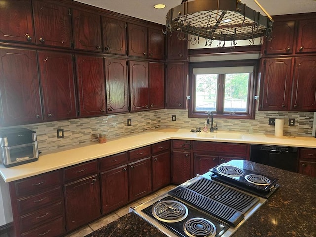 kitchen featuring decorative backsplash, sink, light tile patterned floors, and black dishwasher