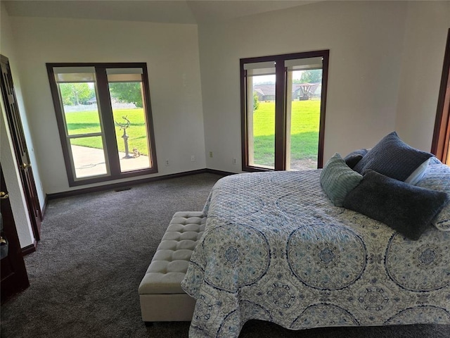 carpeted bedroom featuring multiple windows