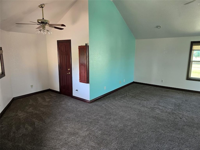 carpeted empty room featuring ceiling fan and high vaulted ceiling