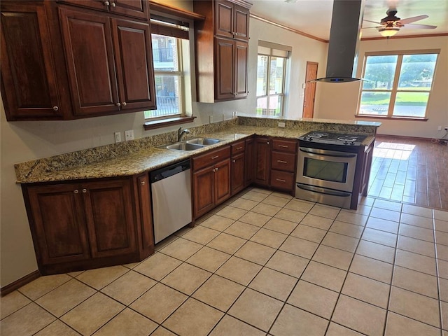 kitchen featuring kitchen peninsula, stainless steel appliances, island range hood, ceiling fan, and sink