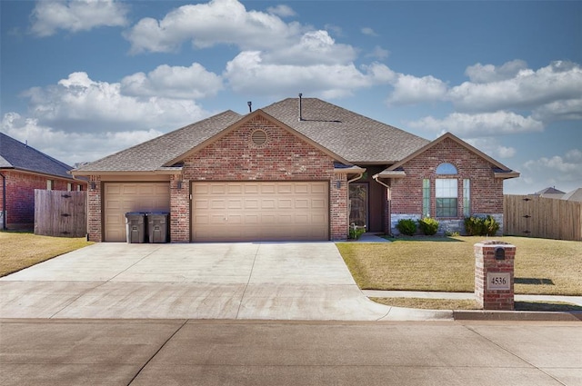 4536 Oasis Ct, Yukon, OK 73099 - traditional-style house with brick siding, concrete driveway, a garage, and a shingled roof