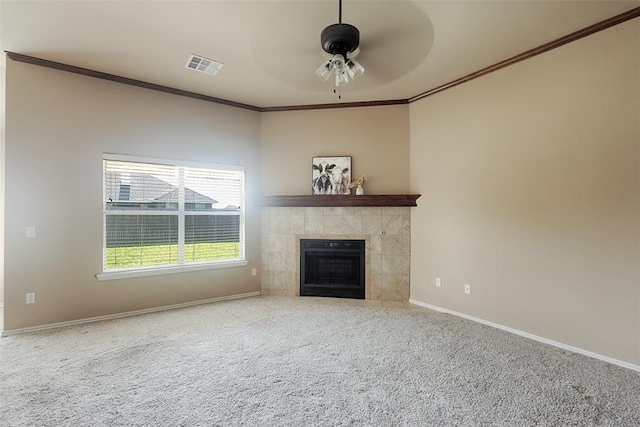 4536 Oasis Ct, Yukon, OK 73099 - unfurnished living room with a ceiling fan, crown molding, carpet, baseboards, and a fireplace