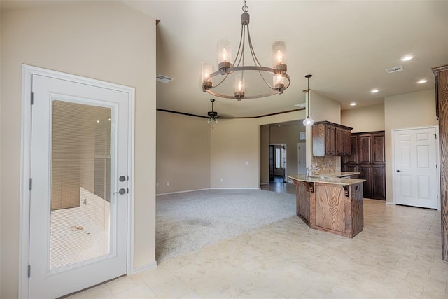 4536 Oasis Ct, Yukon, OK 73099 - kitchen with a chandelier, a kitchen bar, baseboards, decorative light fixtures, and recessed lighting