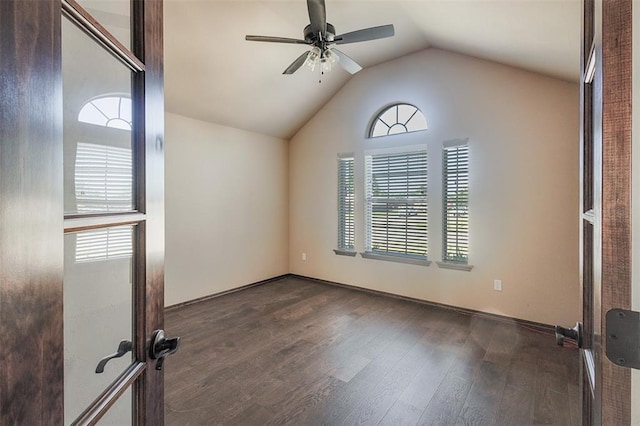 4536 Oasis Ct, Yukon, OK 73099 - spare room with a ceiling fan, dark wood finished floors, vaulted ceiling, and baseboards