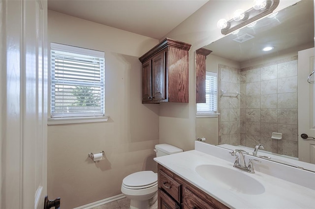 4536 Oasis Ct, Yukon, OK 73099 - full bath with toilet, vanity, baseboards, and a shower