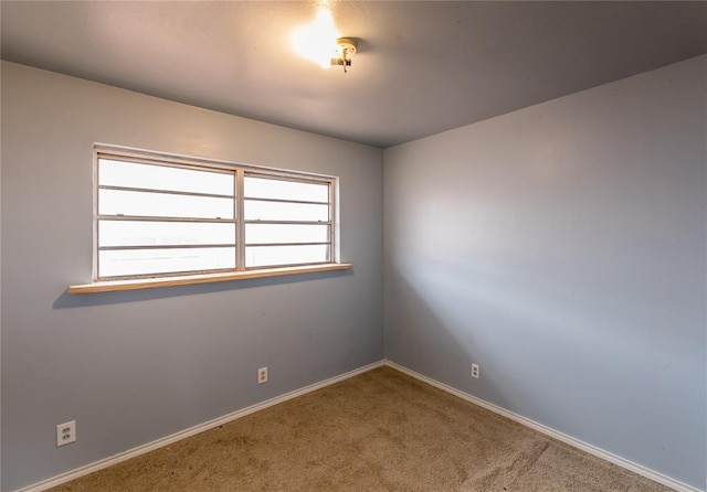 empty room featuring plenty of natural light and carpet floors