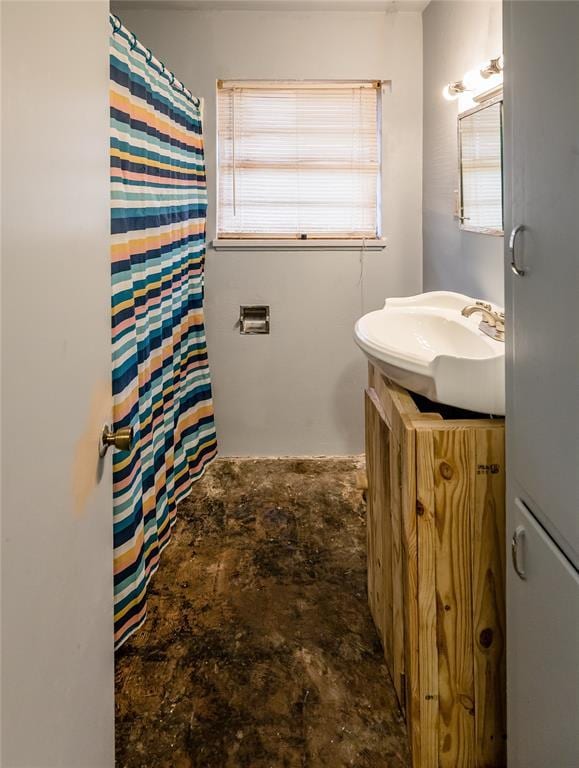 bathroom featuring vanity and concrete floors