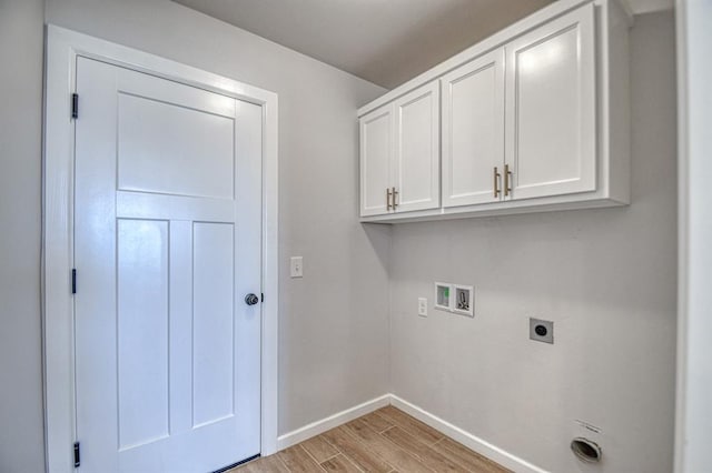 laundry area with electric dryer hookup, cabinets, and hookup for a washing machine