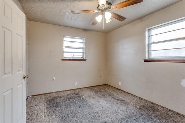unfurnished room featuring baseboards, carpet, a textured ceiling, and a ceiling fan