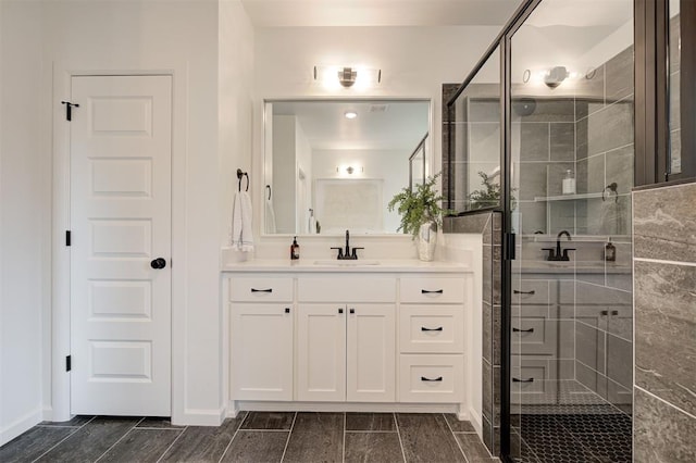 bathroom featuring vanity and walk in shower