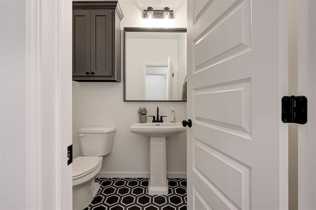 bathroom with sink and toilet