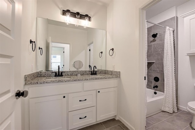 full bathroom with vanity, shower / bathtub combination with curtain, tile patterned floors, and toilet