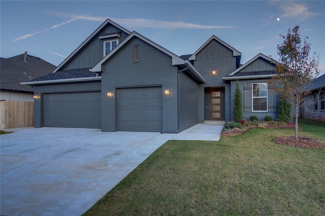 craftsman house featuring a garage and a front yard