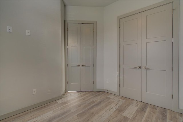 unfurnished bedroom featuring light hardwood / wood-style floors