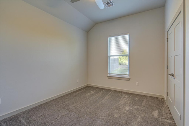 carpeted empty room featuring ceiling fan and lofted ceiling