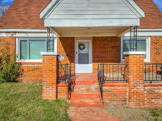 view of exterior entry featuring a porch