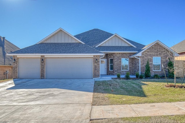 view of front of home featuring a garage and a front yard