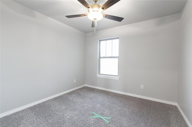 unfurnished room with ceiling fan, baseboards, and carpet floors