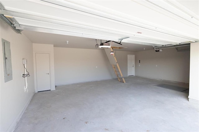 garage featuring a garage door opener, baseboards, and electric panel