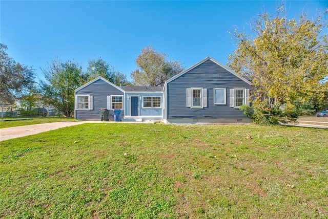 ranch-style home with a front yard