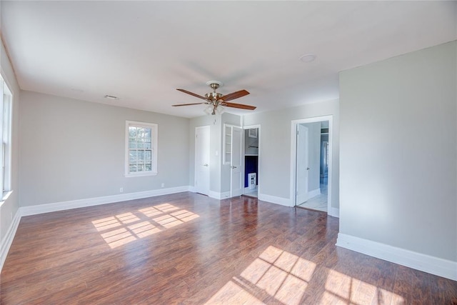 unfurnished room featuring ceiling fan and dark hardwood / wood-style floors