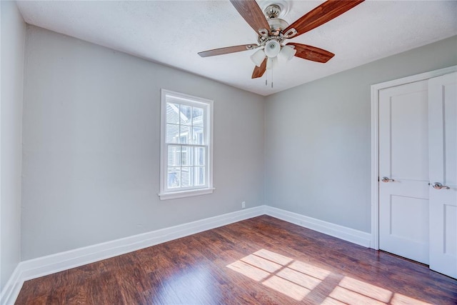 empty room featuring hardwood / wood-style floors and ceiling fan